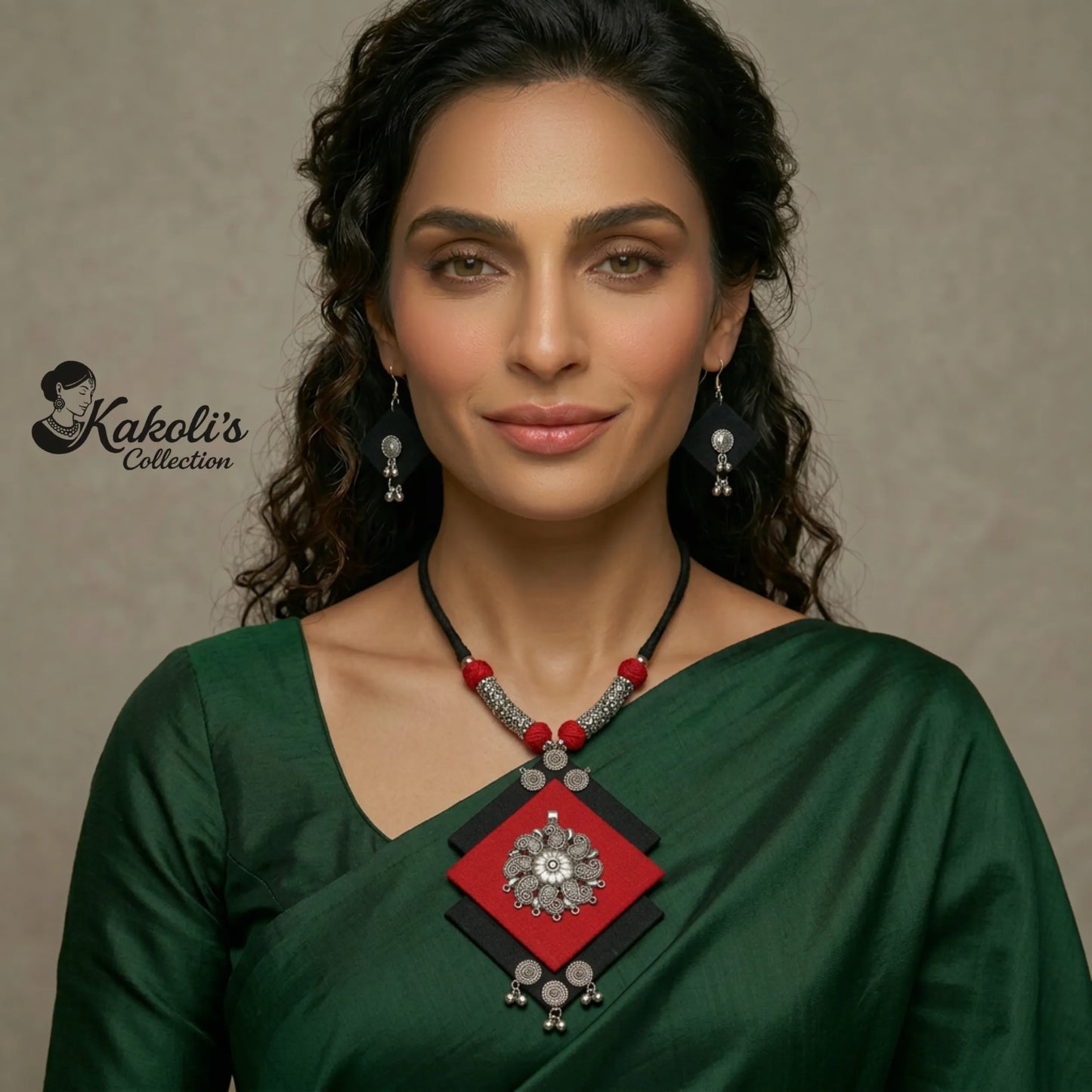 Woman wearing a green saree with a Crimson and Charcoal Geometric Handmade Fabric Necklace Set