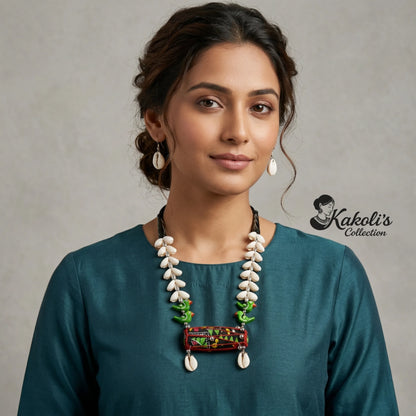 A Model wears Red and Green Tribal Rhythms Dhol and Cowrie Handmade Fabric Necklace Set